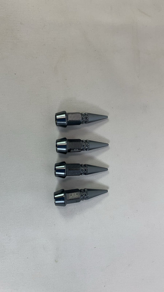 Valve cap spike